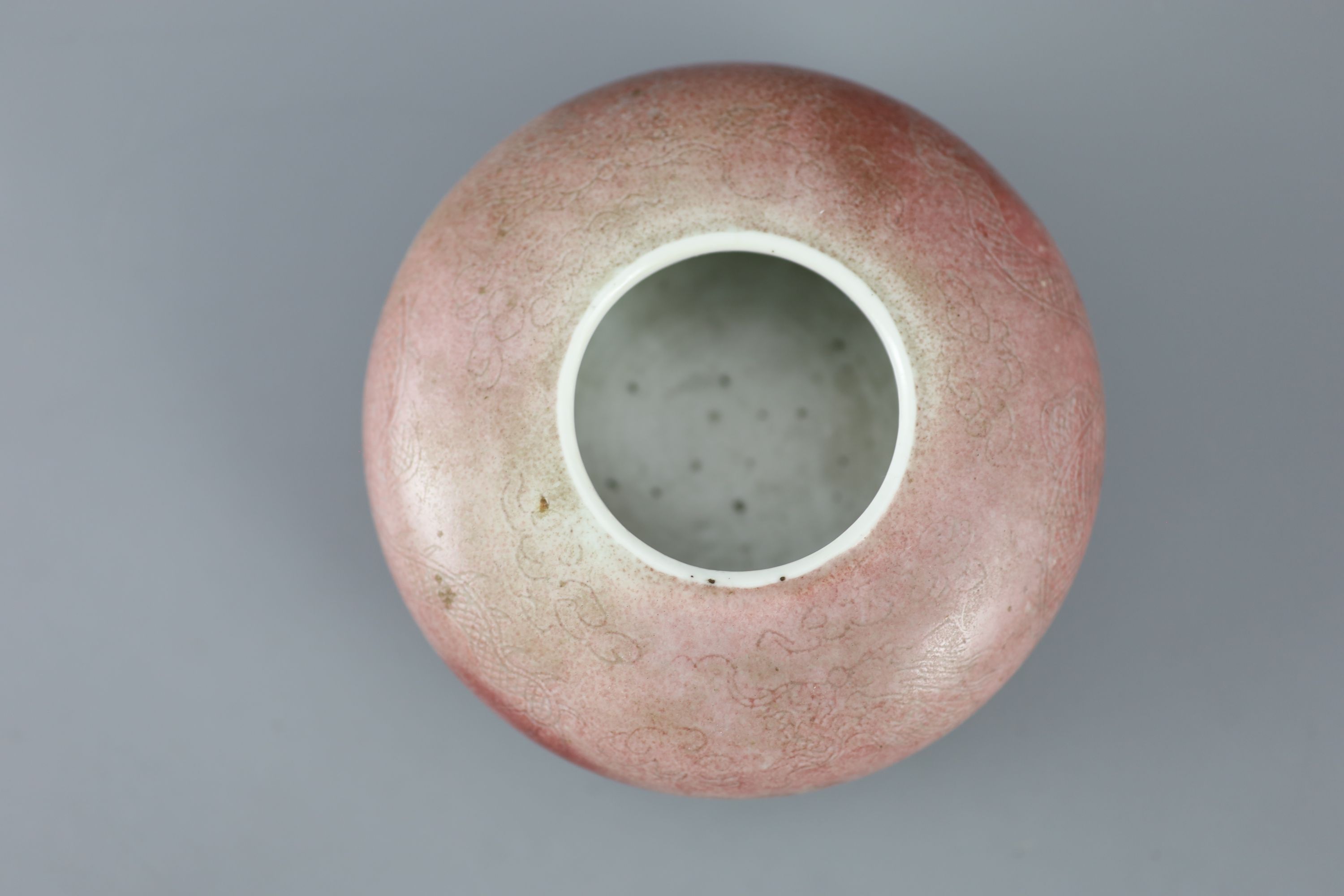 A Chinese peach-bloom dragon water pot, Kangxi six character mark, probably Republic period, 12cm diameter